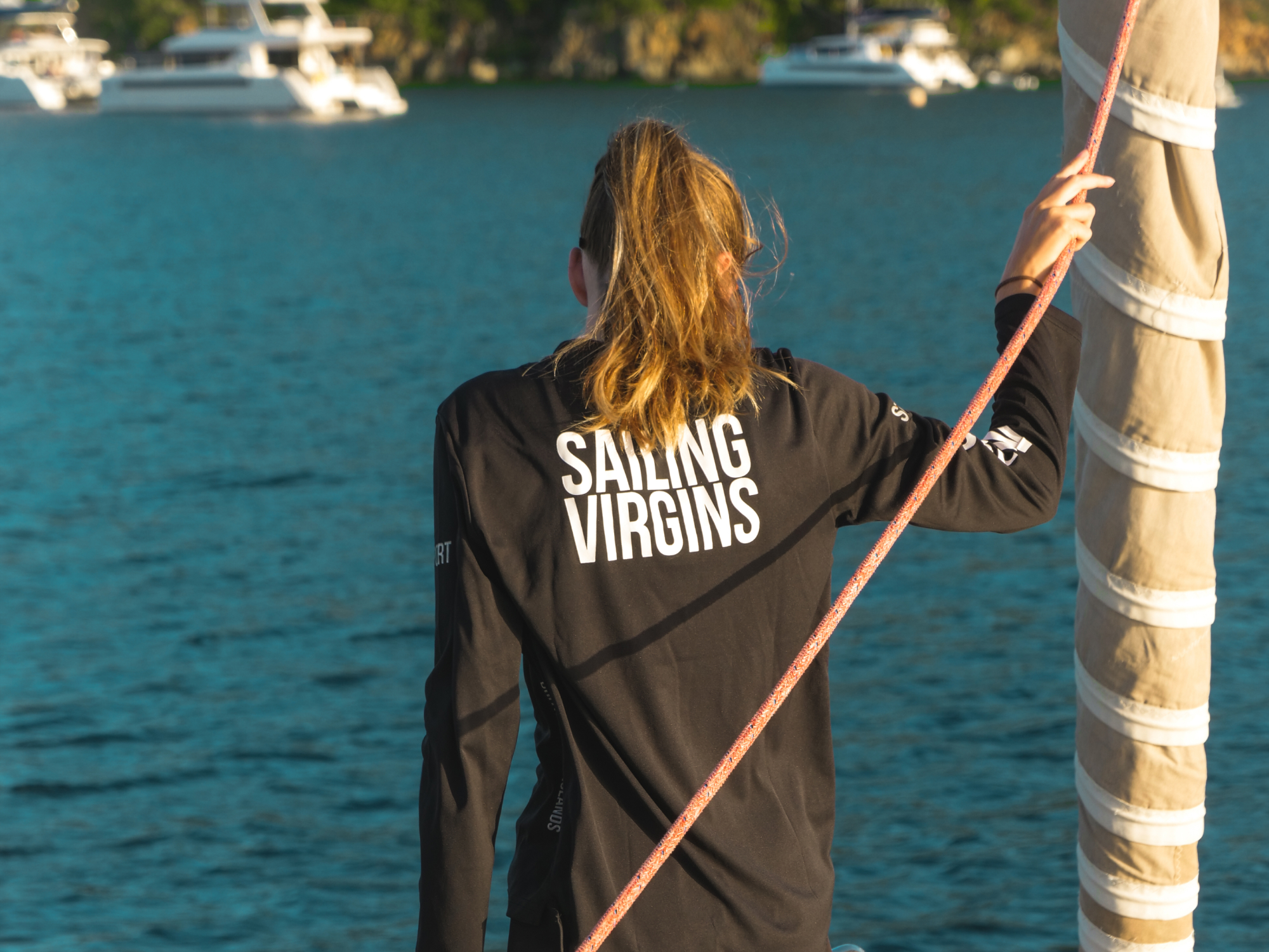 Female sailor anchoring in BVI