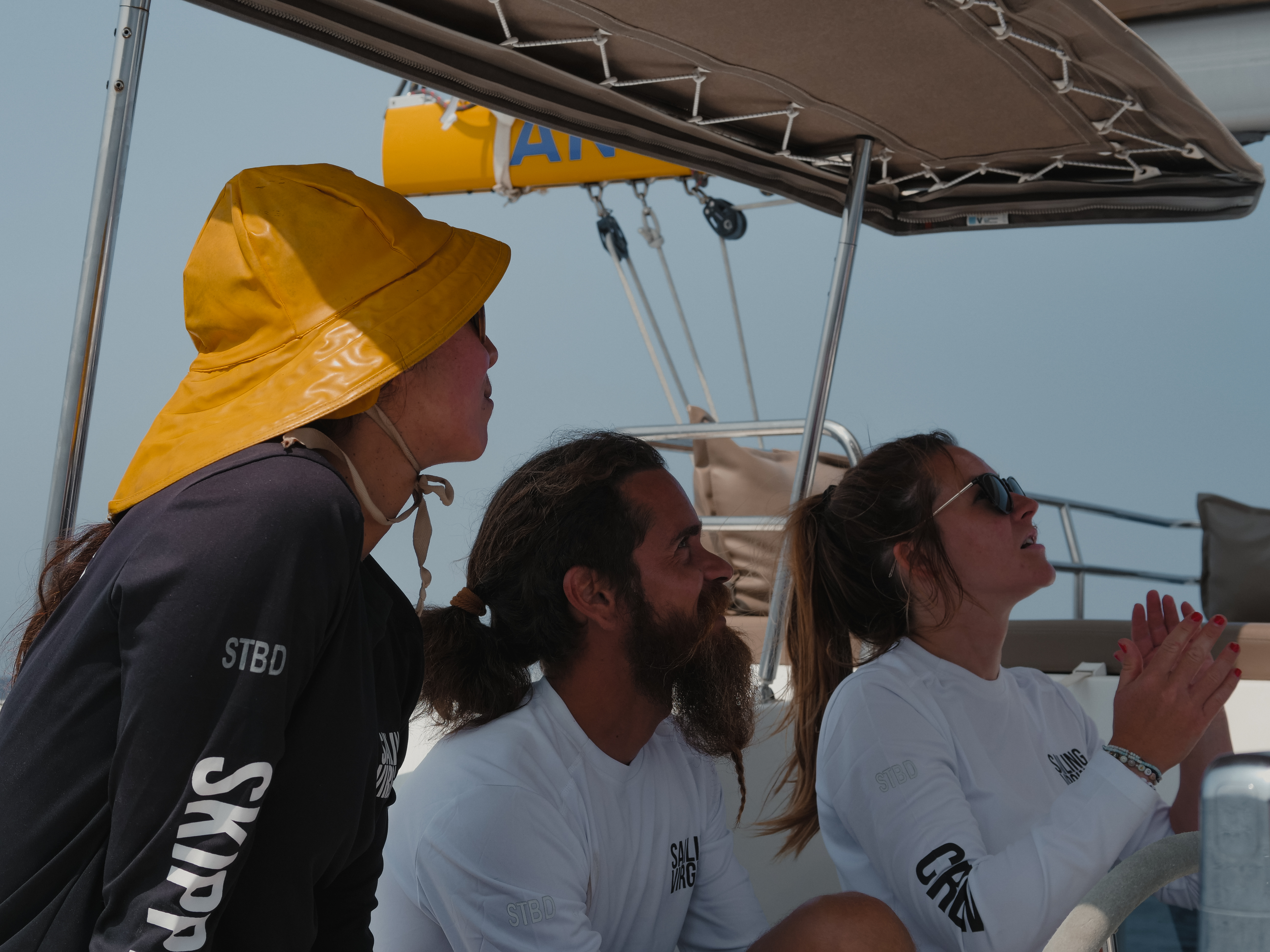 Crew working together on sailing boat